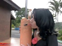 Tranny dances around a pole before stripping completely
