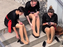Elegant girls in nylons reveal their lovely feet outside