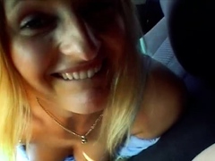 Pretty amateur blonde milks a cock with her lips in the car