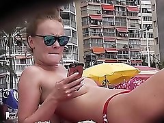 Hidden cam spies on a redhead at the beach
